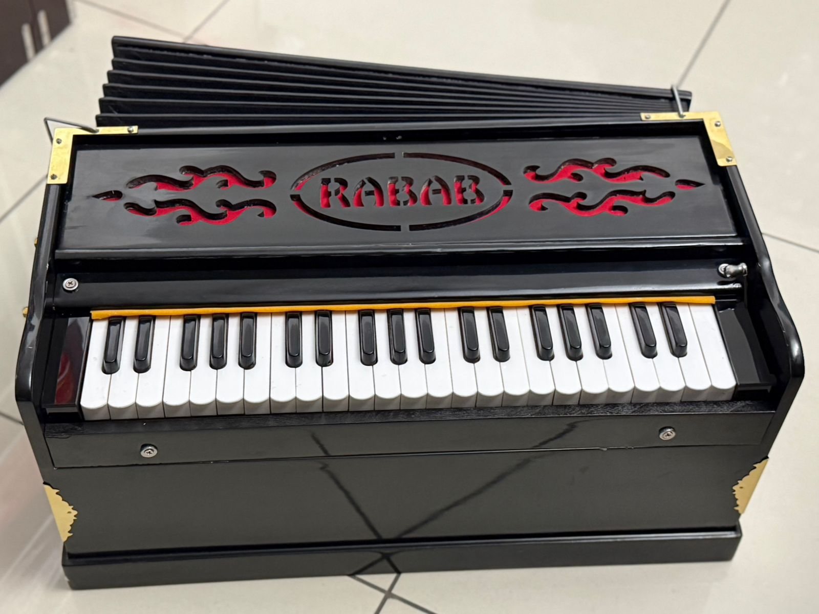 Rabab black harmonium with RABAB nameplate